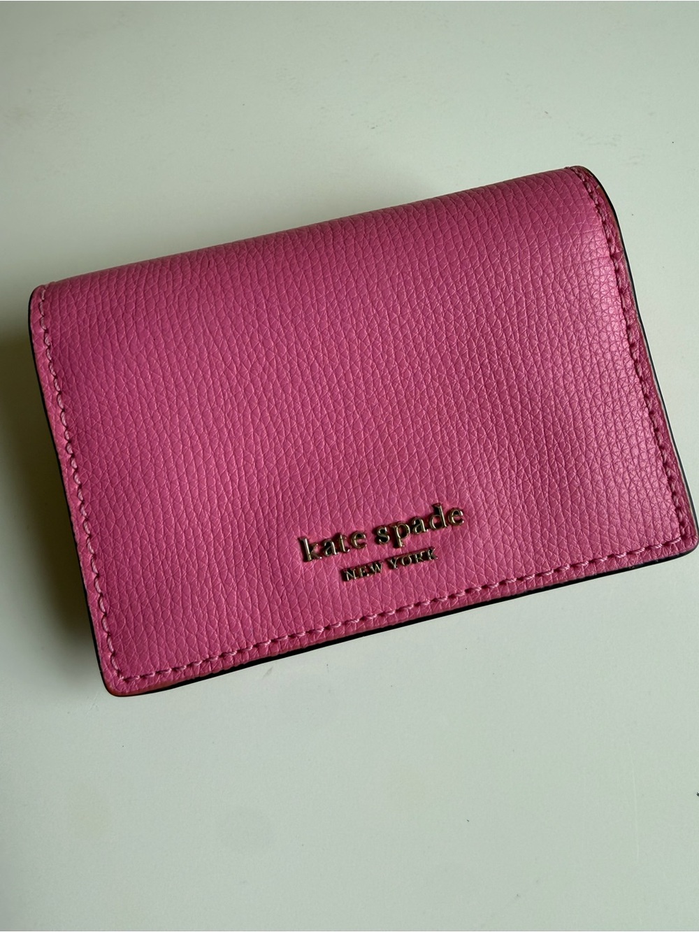 kate spade Hot Pink Pebbled Leather Card Case with Gold Logo